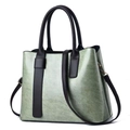 Sage green faux leather tote bag with brown handles and adjustable crossbody strap - Mint Green
