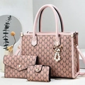 Detailed set of pink tote bag with matching wallet and pearl tassel in minimalist setting - Pink