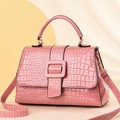 Detail of pink crocodile texture synthetic leather handbag with square buckle and strap - Pink