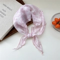 Pink floral triangle neck scarf with white leaf pattern tied in a soft bow style - Pink Bolaire Flower Border