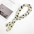 Minimalist beige twilly scarf with black geometric patterns on a lifestyle background - Long Strip Pattern (FJ7016)
