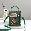 Mini dark green crocodile embossed crossbody bag with cute teddy bear and knit hat detail - Green