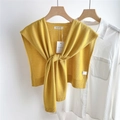 Detail of ginger yellow knitted shawl with knot design and premium ribbed edges - Yellow