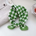 Green and white checkered cotton scarf tied as a stylish hair accessory on a white surface - 07B Checkerboard Green