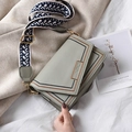 Sage green square crossbody bag with contrast stitching and geometric jacquard strap - Green