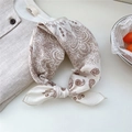 Cream-white retro floral cotton square scarf tied in a knot on a soft linen background - 16B Line Leaf Beige