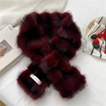 Detail of burgundy plush scarf showing crossover slot and brand woven label on soft fabric - Burgundy