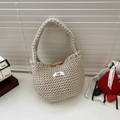 Detail of chunky knit tote bag in oatmeal beige with wooden button and egg logo - Beige