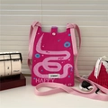 Detail of rose red knitted mini bag with snake pattern, metal snap, and shoulder strap - Rose Red Snake Happy