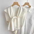 Detailed view of white hollow-out knit shawl with intricate geometric textured patterns - White
