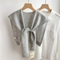 Detail of grey wool knit shawl with hollow wavy texture over white shirt - Gray