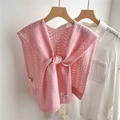 Detail view of pink wool knit shawl with delicate V-shaped hollow pattern and brand tag - 43x100cm / Pink