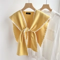 Close-up of yellow knitted shawl wrap with white stitched edges and a bow tie knot - Yellow (White Stitch)