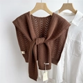 Close-up of brown knit wool shawl with V-shaped cutout patterns and knotted front detail - 43x100cm / Brown