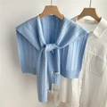 Detail of light blue knitted shawl with hollow vertical stripes and tie knot closure - 48*95cm / Light Blue