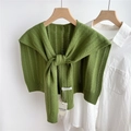 Detail of green knitted hollow pattern shawl with ribbed edge and brand label on a hanger - 48*95cm / Green