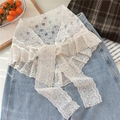 Close-up of a white vintage lace shawl with floral crochet patterns and wavy edges - Sunflower Triangle Beige