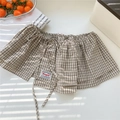 Detailed view of beige plaid skirt cover with drawstring waist and brand label - One Size / Beige Plaid (3 Lattice Long Rope Beige)