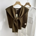 Close-up of olive green knitted wool shawl featuring thick cable knit texture and lapel - 43x100cm / Pickle Green