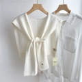 Detail of white 100% wool knitted shawl with a round button over a long sleeve shirt - 43x110cm / Cream