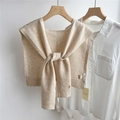 Close-up of lightweight beige 100% wool knitted shawl draped on a hanger with shirt - 43x110cm / Beige