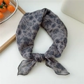 Gray cotton-linen neck scarf featuring black floral prints and a knotted design - Scarf Style / Spoon Flower Khaki