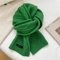 Detail of green cable knit wool scarf with 100% wool label on textured background - 20*170cm / Fresh Green
