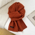 Macro shot of 100% wool scarf showing cable knit texture in retro caramel rust color - 20*170cm / Orange