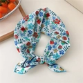 Floral cotton linen square scarf in cream with red and blue flower prints tied as a bow - Double Frame Fluffy Flower