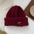 Detailed knit texture of burgundy beanie with silver metal logo accent on warm background - One Size (22*25cm) / Wine Red (Metal Label)