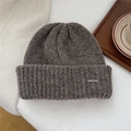 Close-up of a dark brown chunky knit hat featuring a BOWLOW metal logo nameplate - One Size (22*25cm) / Coffee (Metal Label)