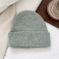 Close-up of winter wool beanie with thick vertical rib knit and folded brim details - Starry Light Green