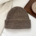 Detail of knit wool beanie featuring speckled yarn texture and ribbed cuff design - Starry Brown