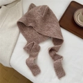 Detail of camel knit cat ear hat with long straps on soft white bedding background - Coffee (4BOWLOW Fox Coffee)