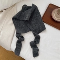 Detail of dark grey knitted shawl scarf with soft plush texture on white bedding - Grey (7BOWLOW Fox Grey)
