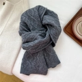 Detailed view of dark grey thick cable knit wool scarf with warm autumn aesthetic - 21*160cm / Gray