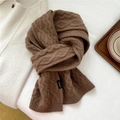 Close-up of deep brown 100% wool scarf with classic cable knit texture and washing label - 21*160cm / Brown