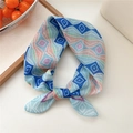 Bohemian geometric pattern silk scarf with blue and orange diamond print tied in a bow - Geometric Blue