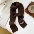 Close-up of a dark brown mohair knit scarf with a vintage woven label on white background - Dark Brown