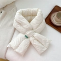 Detail of off-white padded scarf with cross-over slot and green square brand label - Cream