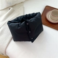 Detail of black quilted neck warmer featuring secure three-button snap closure - 15*65cm / Black