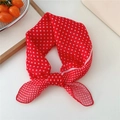 Red cotton linen neckerchief with white polka dots tied in a bow on a white desk - Red And White Polka Dot