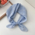Light blue plaid cotton linen square scarf tied in a stylish decorative knot - Blue Plaid