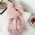 Detail of soft pink knitted scarf with decorative label and long tassels on white surface - 28*210cm / Korean Pink