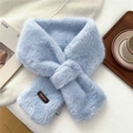 Close-up of light blue plush faux fur scarf with cross-over slit and leather brand tag - Blue