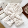 Detailed close-up of cream faux fur scarf showing soft plush texture and brand label - Cream