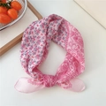 Pink paisley and floral cotton-linen square scarf tied in a stylish loop on white surface - Floral Large Paisley Rose Red Frame