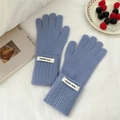 Detail view of smog blue knitted gloves with ribbed cuffs and decorative brand patch - One Size / Haze Blue