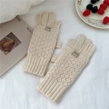 Detailed knit texture of cream diamond pattern gloves with rib cuff and logo tag - Off White