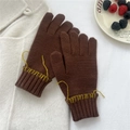 Detail of dark brown knitted gloves with yellow hand-stitched cuffs for winter warmth - One Size / Fingered Gloves (Two Fingers Exposed) / Brown